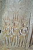 Angkor Wat temple, second enclosure, devatas sculpted in bas-relief with an extraordinary variety of intricate hair styles and costumes. 